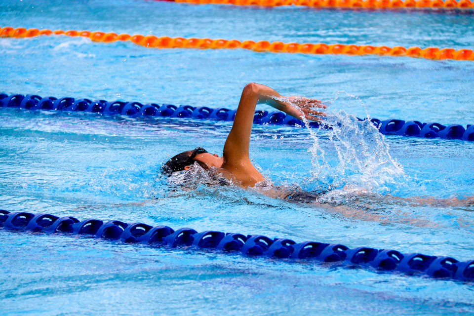 A swimmer in a 50 m Olympic-size pool